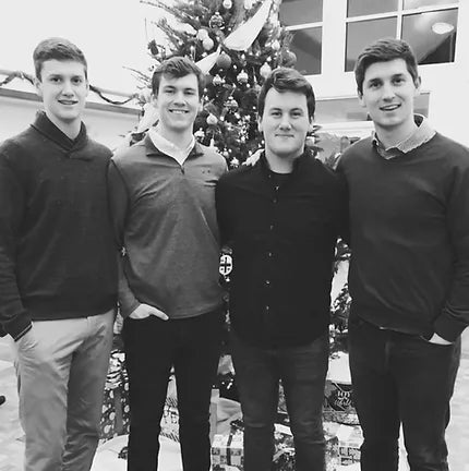 Four Brothers Standing Next to One another